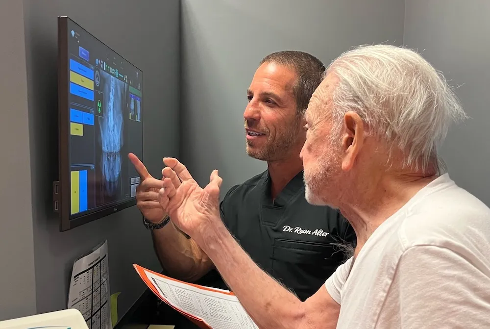 Dr. Ryan Alter discussing with a patient
