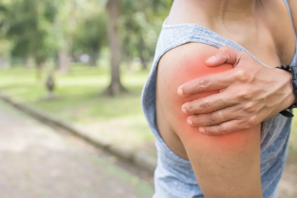 person holding a painful shoulder